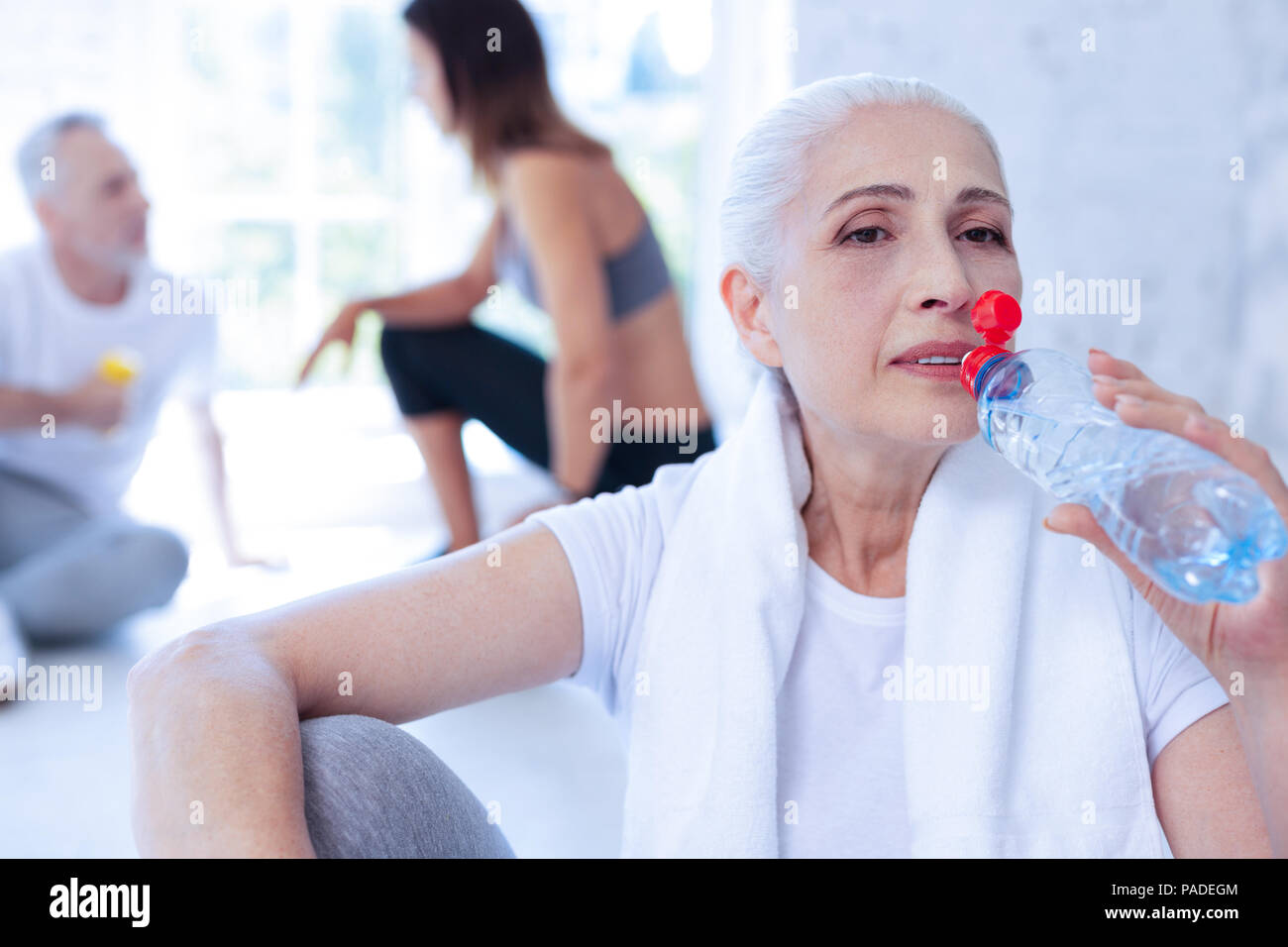 Attentive female going to refresh herself Stock Photo