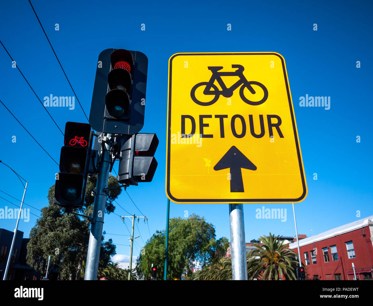 Sign of cycleway detour near traffic light on urban street. Melbourne, VIC Australia. Stock Photo