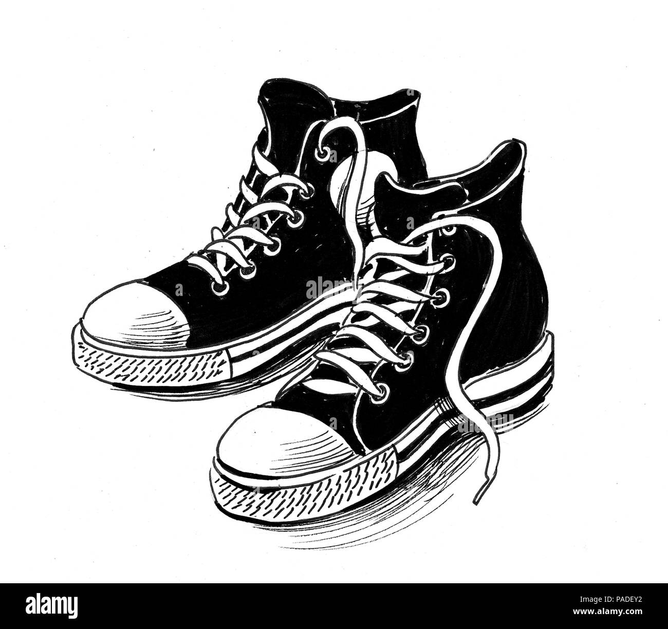 A pair of sport shoes. Ink black and white illustration Stock Photo - Alamy
