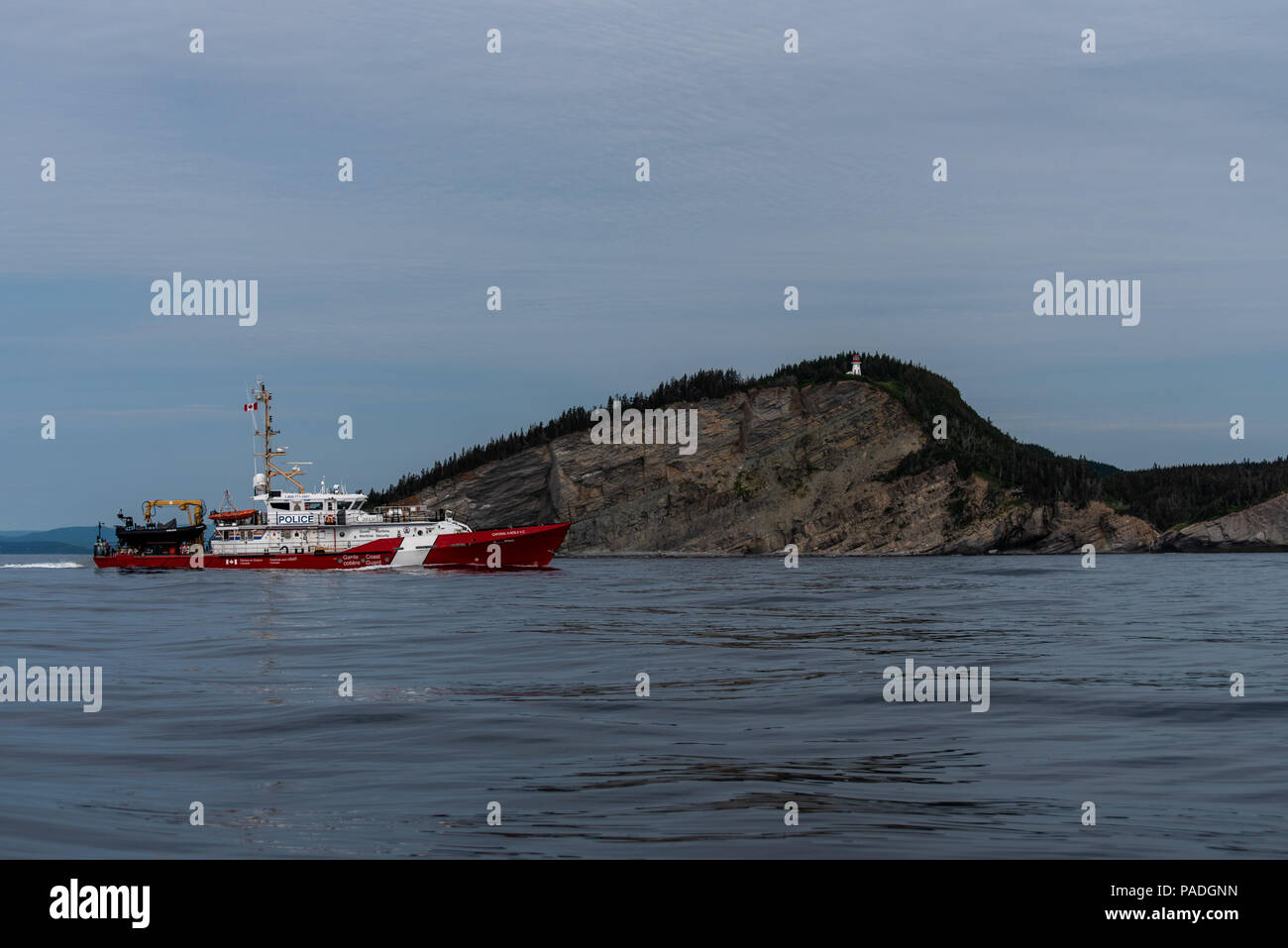 Canadian Coast Guard cutter on patrol below Cap Gaspe in the Gulf of Saint-Lawrence, Quebec, Canada Stock Photo