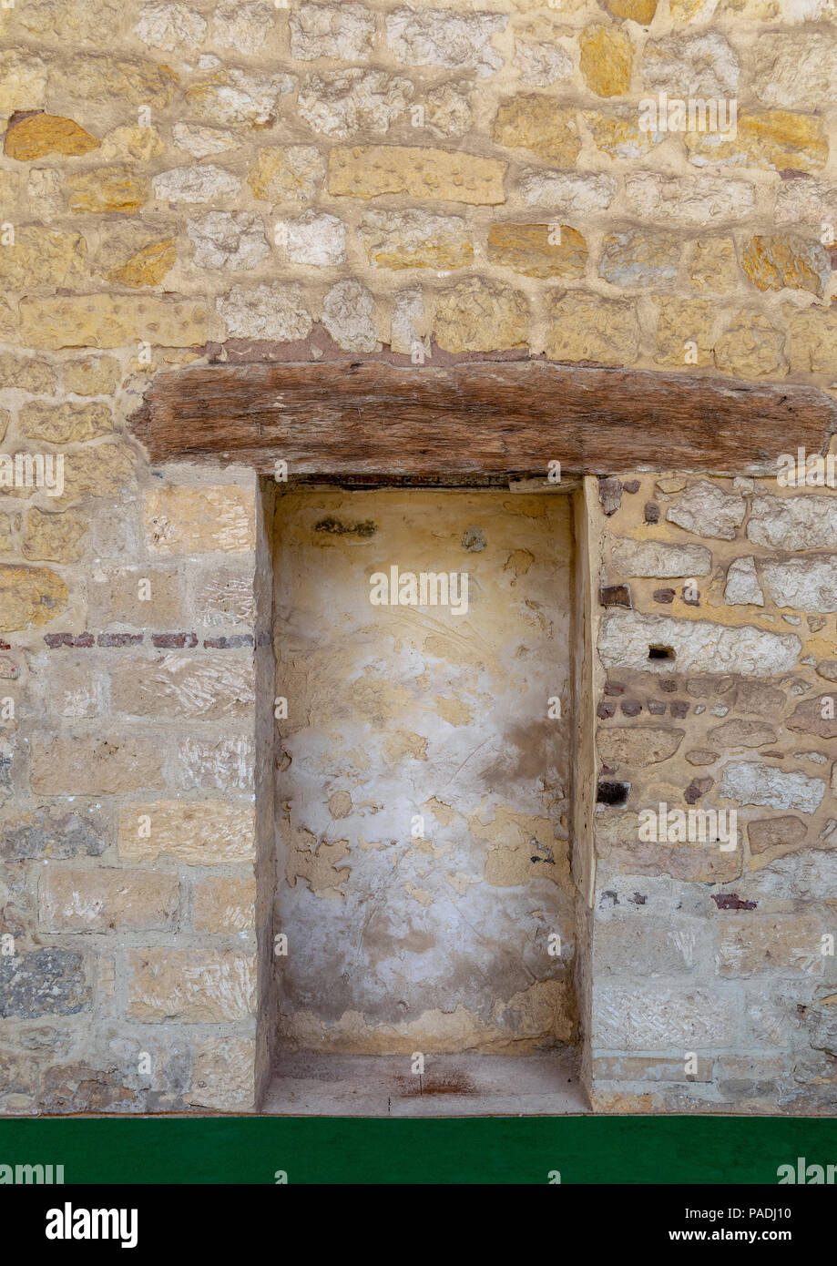 Recessed frame in an old stone bricks wall, Medieval Cairo, Egypt Stock Photo