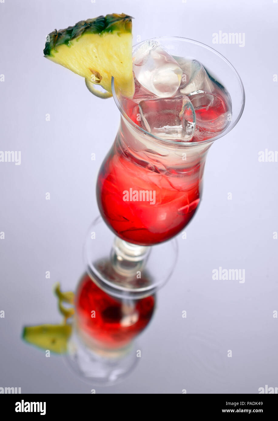 iced rum cocktail with pineapple on grey Stock Photo Alamy