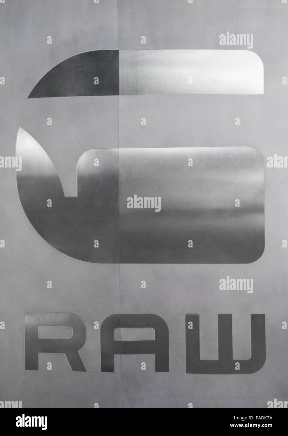 AMSTERDAM, NETHERLANDS - JULY 18, 2018: G-Star Raw shop logo on steel plate with reflection Stock Photo