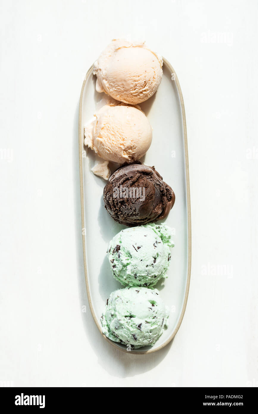 Selection of different ice cream scoops such as mint, chocolate and