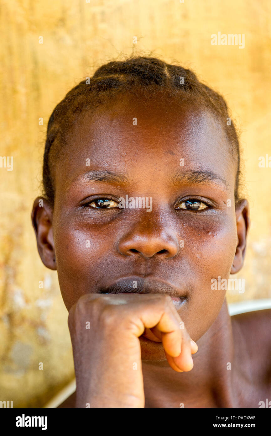 PORTO-NOVO, BENIN - MAR 10, 2012: Unidentified Beninese local woman portrait. People of Benin suffer of poverty due to the difficult economic situatio Stock Photo