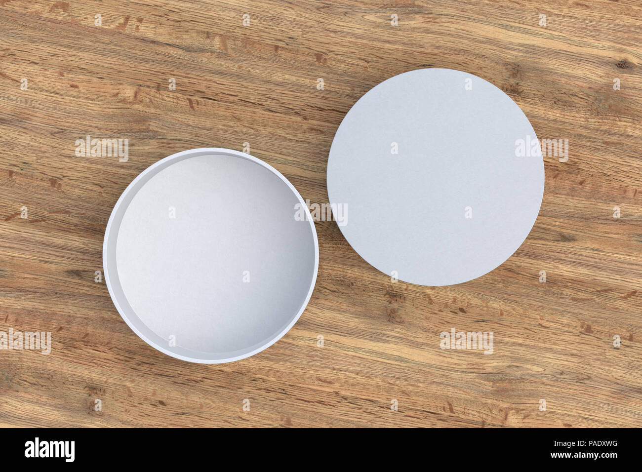 Two white round boxes opened and closed on wood background. 3d