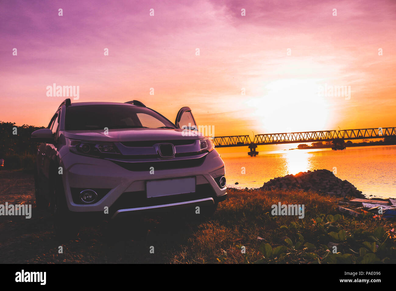 White car with sunset background Stock Photo - Alamy