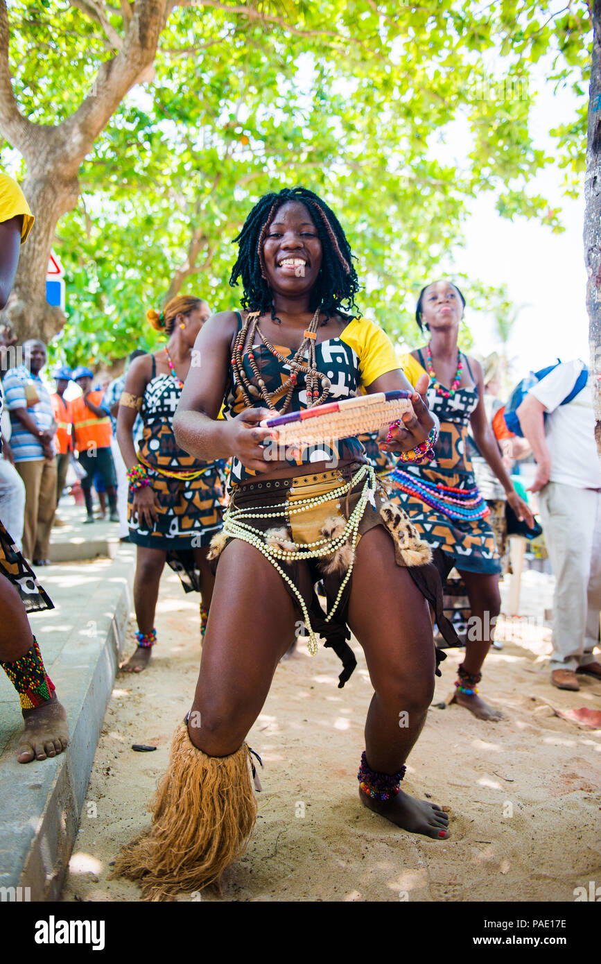 ANGOLA, LUANDA - MARCH 4, 2013: Smiling Angolan woman dances the local falk  dance in Angola, Mar 4, 2013. Music is one of the main African entertainme  Stock Photo - Alamy