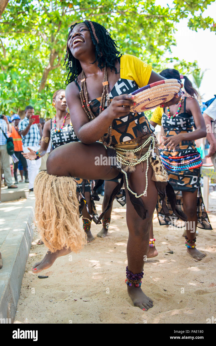 ANGOLA, LUANDA - MARCH 4, 2013: Close view of a smiling Angolan woman  dances the local falk dance in Angola, Mar 4, 2013. Music is one of the  main Afr Stock Photo - Alamy