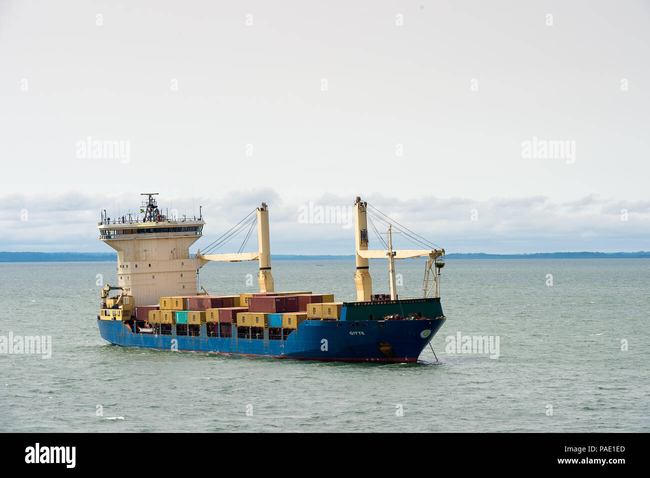 LIBREVILLE, GABON - MAR 6, 2013: Cargo ship near the port of Libreville. Port of Libreville is a trade center for a timber region. Stock Photo