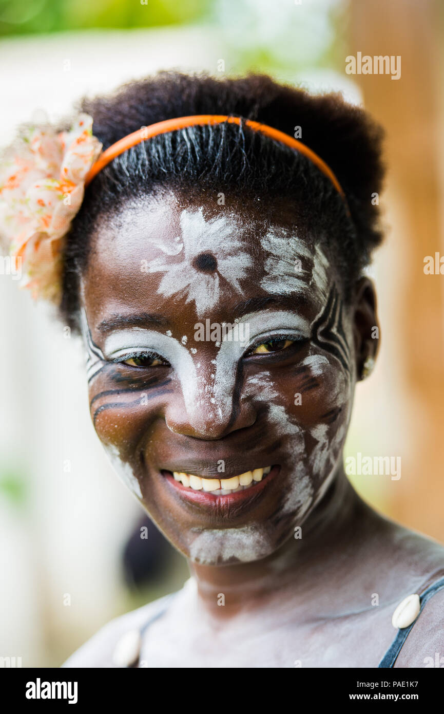GABON - MARCH 6, 2013: Portrait of an unidentified Gabonese girl with the white paint drawings on her face in Gabon, Mar 6, 2013. White paint symboliz Stock Photo