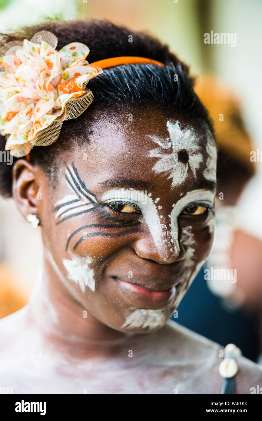 GABON - MARCH 6, 2013: Portrait of an unidentified Gabonese girl with the white paint drawings on her face in Gabon, Mar 6, 2013. White paint symboliz Stock Photo