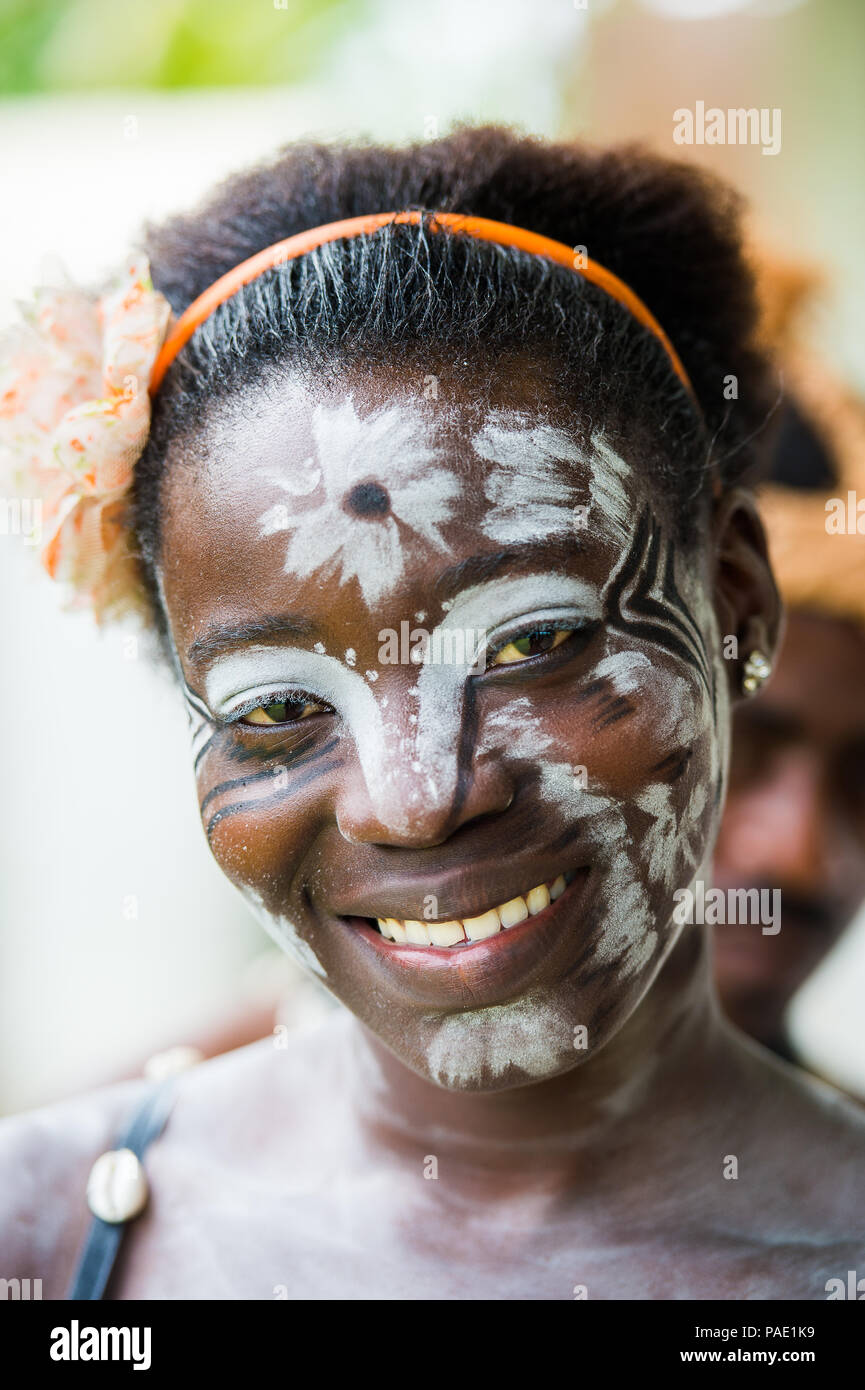 GABON - MARCH 6, 2013: Portrait of an unidentified Gabonese girl with the white paint drawings on her face in Gabon, Mar 6, 2013. White paint symboliz Stock Photo