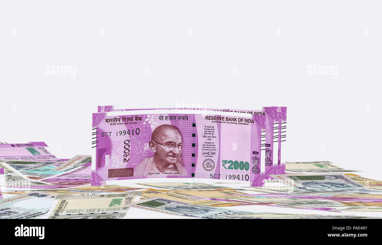 2000 rupees new notes Indian currency front view on the stack of 500, 200, 2000 rupee Indian currencies on background stock image Stock Photo