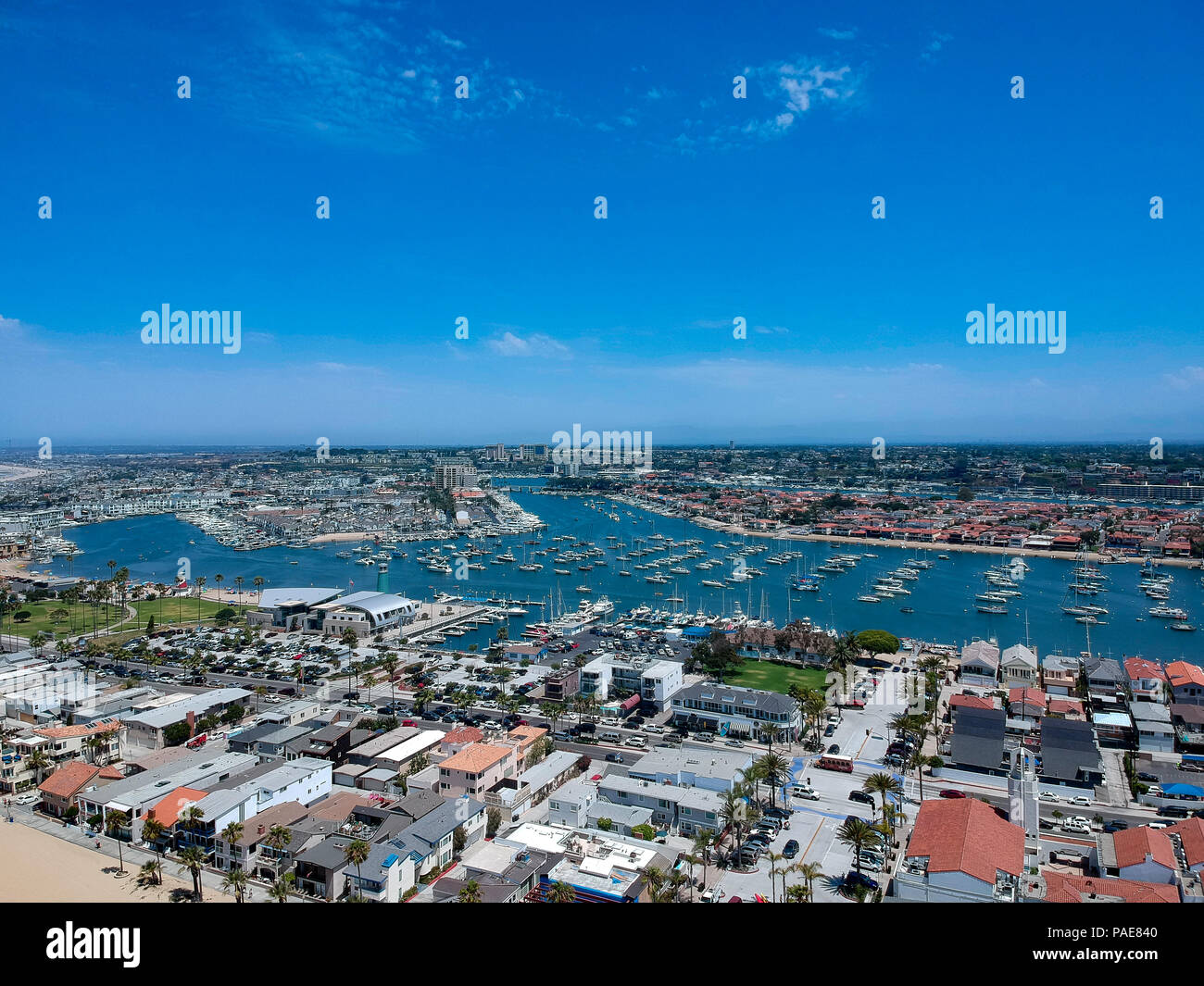 A California bay filled with sail boats ready to cruise the Pacific Ocean. Image captured from an aerial drone at 300 feet in altitude Stock Photo