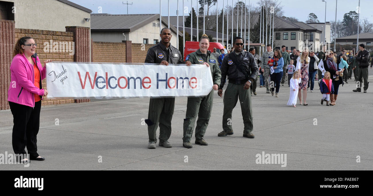 76th Airlift Squadron Airmen and family members welcome redeployers back from Afghanistan March 15, 2016, at Ramstein Air Base, Germany. Ten Airmen from the 76th AS were deployed for 2 ½ months. (U.S. Air Force photo/Airman 1st Class Larissa Greatwood) Stock Photo