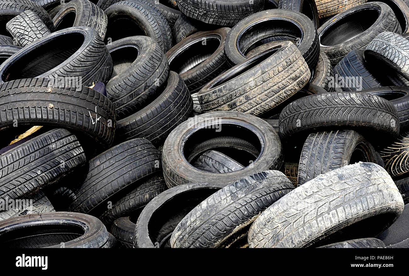 Tires lay in a pile at the Ramstein Automotive Recycling Center March 1, 2016, at Ramstein Air Base, Germany. The center receives 70 to 80 cars a month and consistently sells car parts for prices comparable to those at a local establishment. (U.S. Air Force photo/Airman 1st Class Larissa Greatwood) Stock Photo