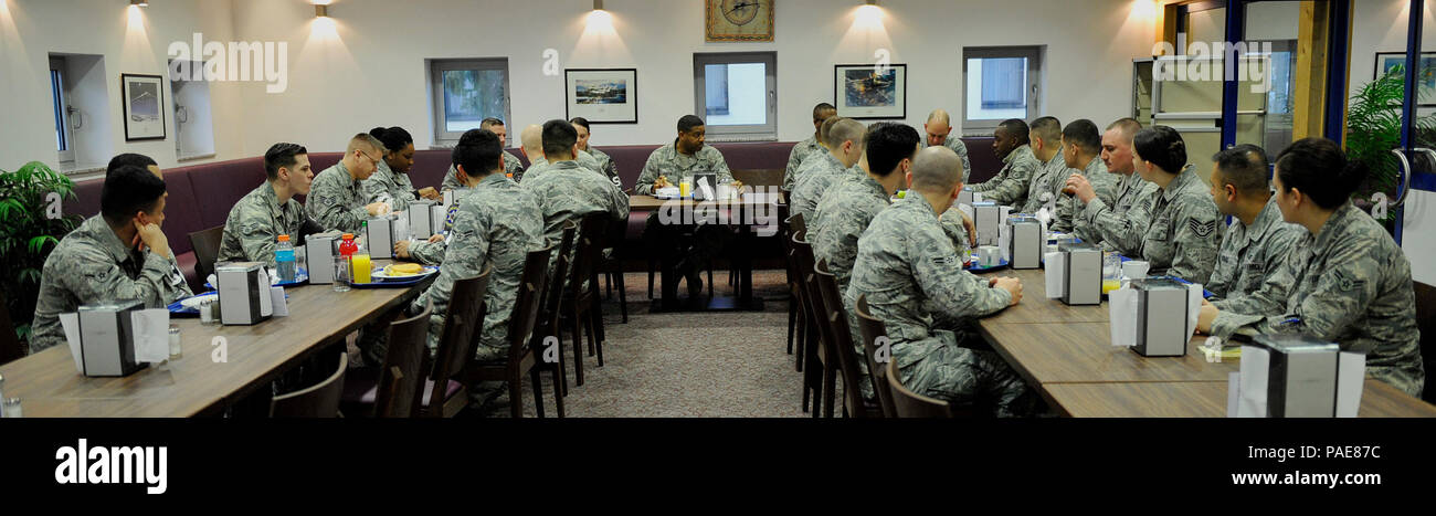 Chief Master Sgt. Phillip L. Easton (center), 86th Airlift Wing command chief, speaks with Airmen during an enlisted breakfast March 11, 2016, at Kapaun Air Station, Germany. Airmen had the opportunity to ask Easton questions about concerns, processes and how to become front-line supervisors. (U.S. Air Force photo/Airman 1st Class Larissa Greatwood) Stock Photo