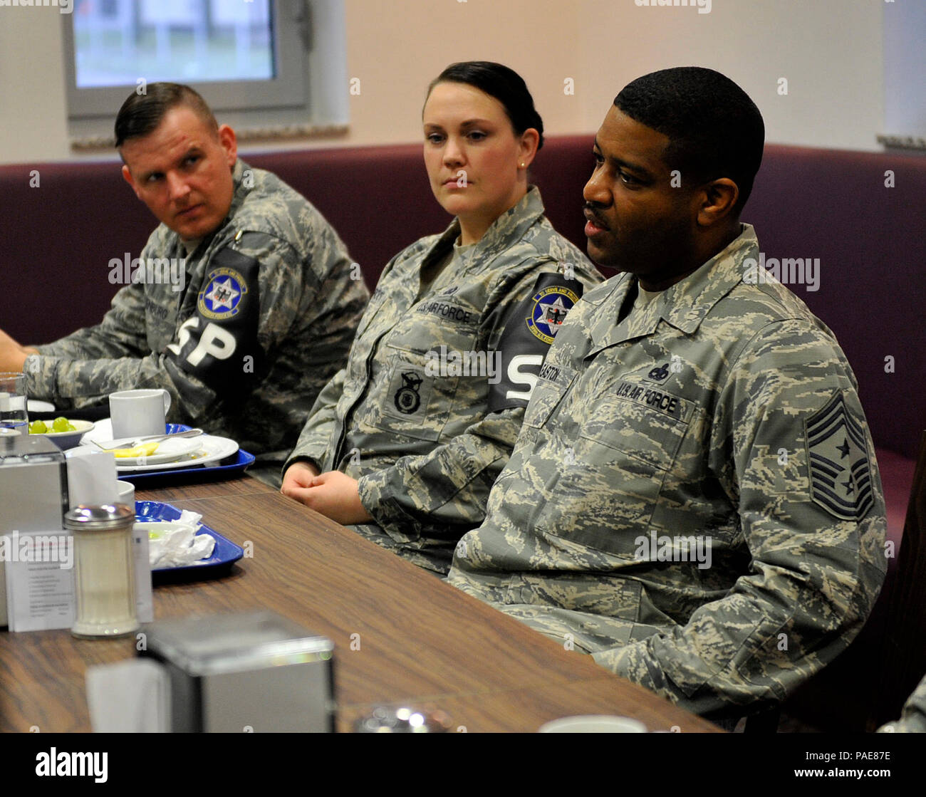 Chief Master Sgt. Phillip L. Easton (right), 86th Airlift Wing command chief, talks with Airmen during an enlisted breakfast March 11, 2016, at Kapaun Air Station, Germany. Easton spoke to the Airmen about his military service and answered questions they had about changes at Ramstein and across the Air Force. (U.S. Air Force photo/Airman 1st Class Larissa Greatwood) Stock Photo