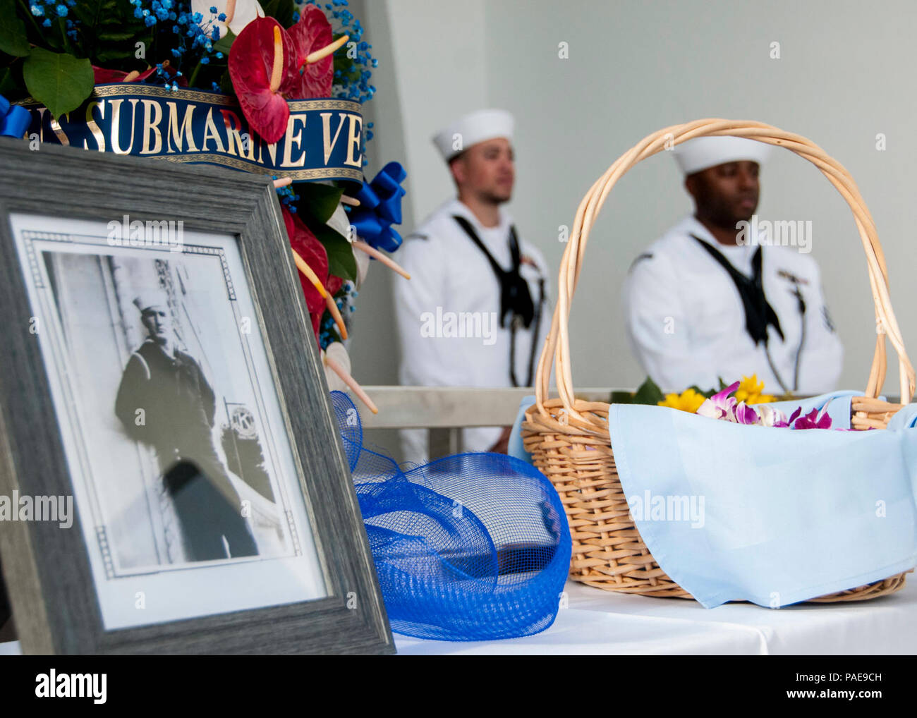 PEARL HARBOR (Dec. 7, 2017) A framed photo is showcased of Chief Boatswain’s Mate Joseph George, who was posthumously awarded the Bronze Star with Valor during a ceremony aboard the USS Arizona Memorial. The 76th commemoration of the attacks on Peal Harbor, co-hosted by the U.S. Military, the National Park Service and the State of Hawaii, provided veterans, family members, service members and the community a chance to honor the sacrifices made by those who were present Dec. 7, 1941, as well as throughout the Pacific theater. Since the attacks, the U.S. and Japan have endured more than 70 years Stock Photo
