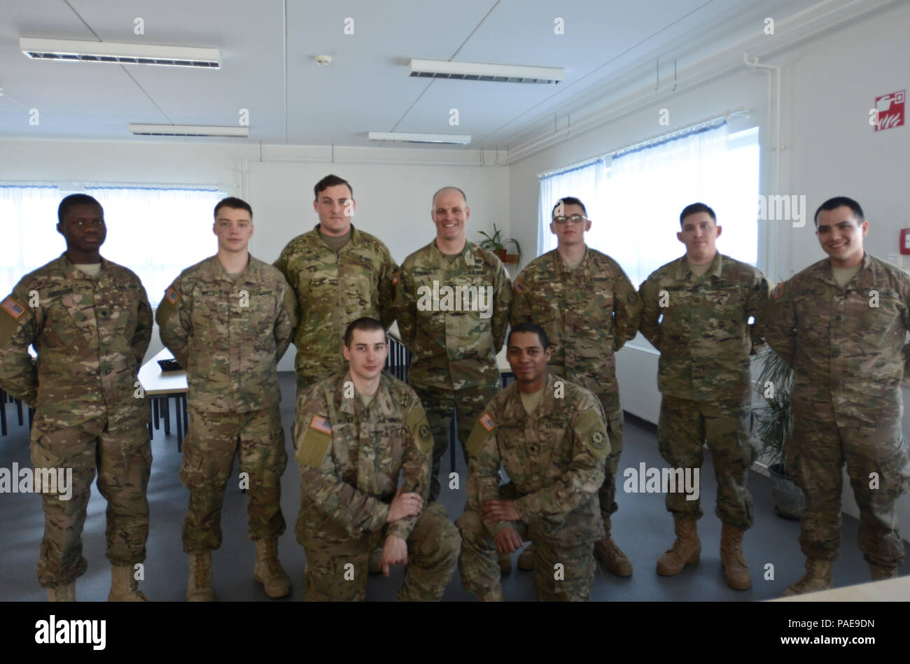 U.S. Army Col. John V. Meyer III (center back row), the commander of ...