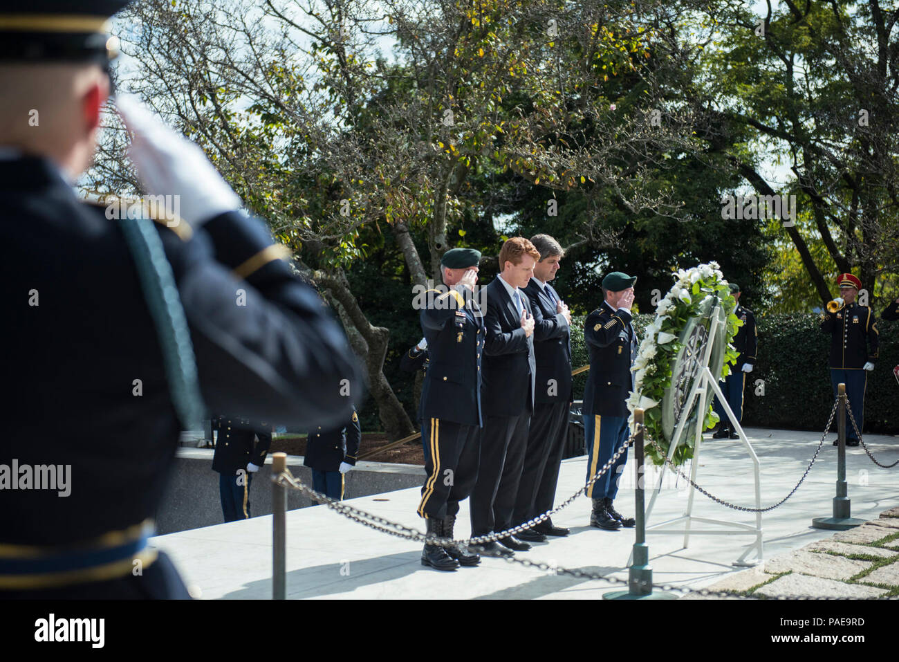 (From the left) U.S. Army Maj. Gen. Fran Beaudette, commanding general, 1st Special Forces Command (Airborne); Congressman Joe Kennedy III; Dr. William Kennedy Smith; and Command Sgt. Maj. Brian Rarey, 1st SFC (A) Command Sergeant Major; renders honors during the 1st Special Forces Command (Airborne) Wreath-Laying Ceremony at the gravesite of President John F. Kennedy at Arlington National Cemetery, Arlington, Virginia, Oct. 25, 2017.  Kennedy contributed greatly to the Special Forces, including authorizing the “Green Beret” as the official headgear for all U.S. Army Special Forces. Stock Photo