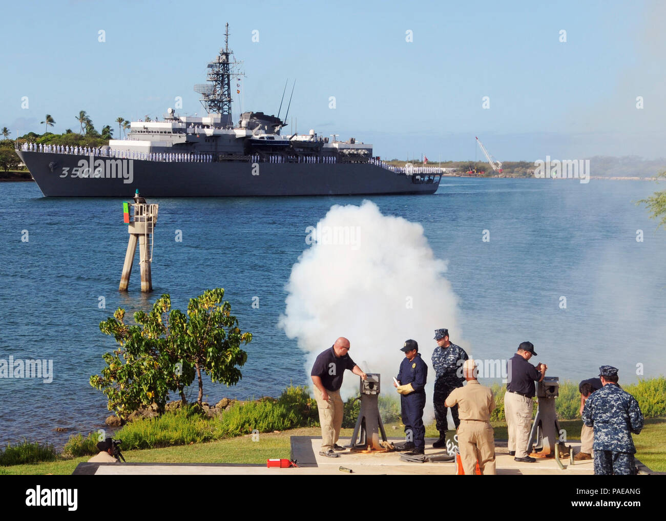 Members of Lockheed Martin and Joint Base Pearl Harbor-Hickam Security Department perform a 21-gun salute for the arrival of the Japan Maritime Self-Defense Force training squadron ship JS Kashima (TV 3508) for a port visit. This year marks the 50th anniversary of the U.S. and Japan Treaty of Mutual Cooperation of Security that in 1960 established the alliance between the two countries. Stock Photo