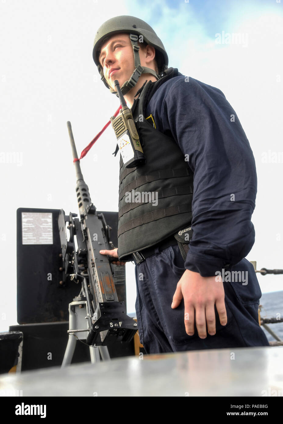 160325-N-DQ503-028ATLANTIC OCEAN (March 25, 2016) – Gunner’s Mate 2nd Class Jacob Kearney, from Wausa, Nebraska, mans a .50 caliber machine gun for his small caliber assault team (SCAT) station on the forecastle aboard the guided-missile destroyer USS Roosevelt (DDG 80) during a strait transit exercise. Roosevelt is underway conducting Composite Training Unit Exercise (COMPTUEX) with the Eisenhower Carrier Strike Group in preparation for a future deployment. (U.S. Navy Photo by Mass Communication Specialist 3rd Class Taylor A. Elberg/Released) Stock Photo