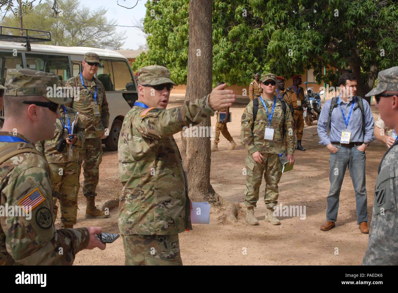 Maj. Sean Burnett, S-3 for the 9th Brigade Engineer Battalion, points out some key landmarks during a guided tour of the Western Accord 2016 training site at the Burkina Faso Armed Forces Noncommissioned Officer Academy March 22. WA 2016 is a two-week long exercise with regional African partners and their Western allies designed to strengthen partnerships and enhance capacity and capabilities to conduct joint multinational peacekeeping operations in West Africa. (U.S. Army Africa photo by Sgt. 1st Class Chris Bridson) Stock Photo