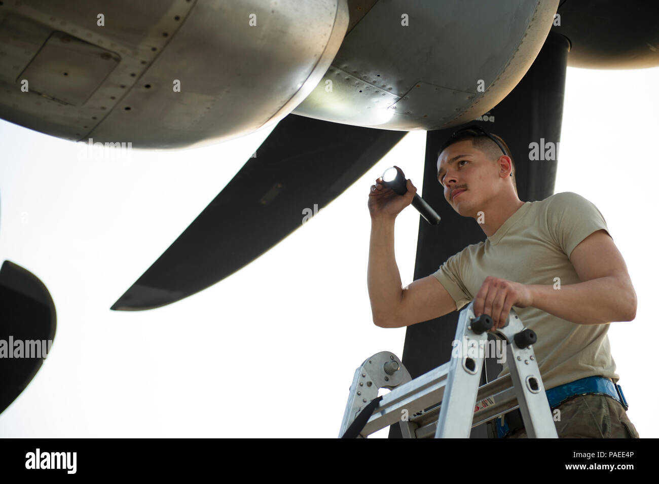 Senior Airman Alec Flores, 455th Expeditionary Aircraft Maintenance Squadron crew chief, visually inspects the intake of C-130J Super Hercules during a basic post flight and preflight combo inspection at Bagram Airfield, Afghanistan, March 29, 2016. Members of the 455th EAMXS ensure that aircraft at Bagram are prepared for flight and return them to a mission-ready state once they land. (U.S. Air Force photo/Tech. Sgt. Robert Cloys) Stock Photo