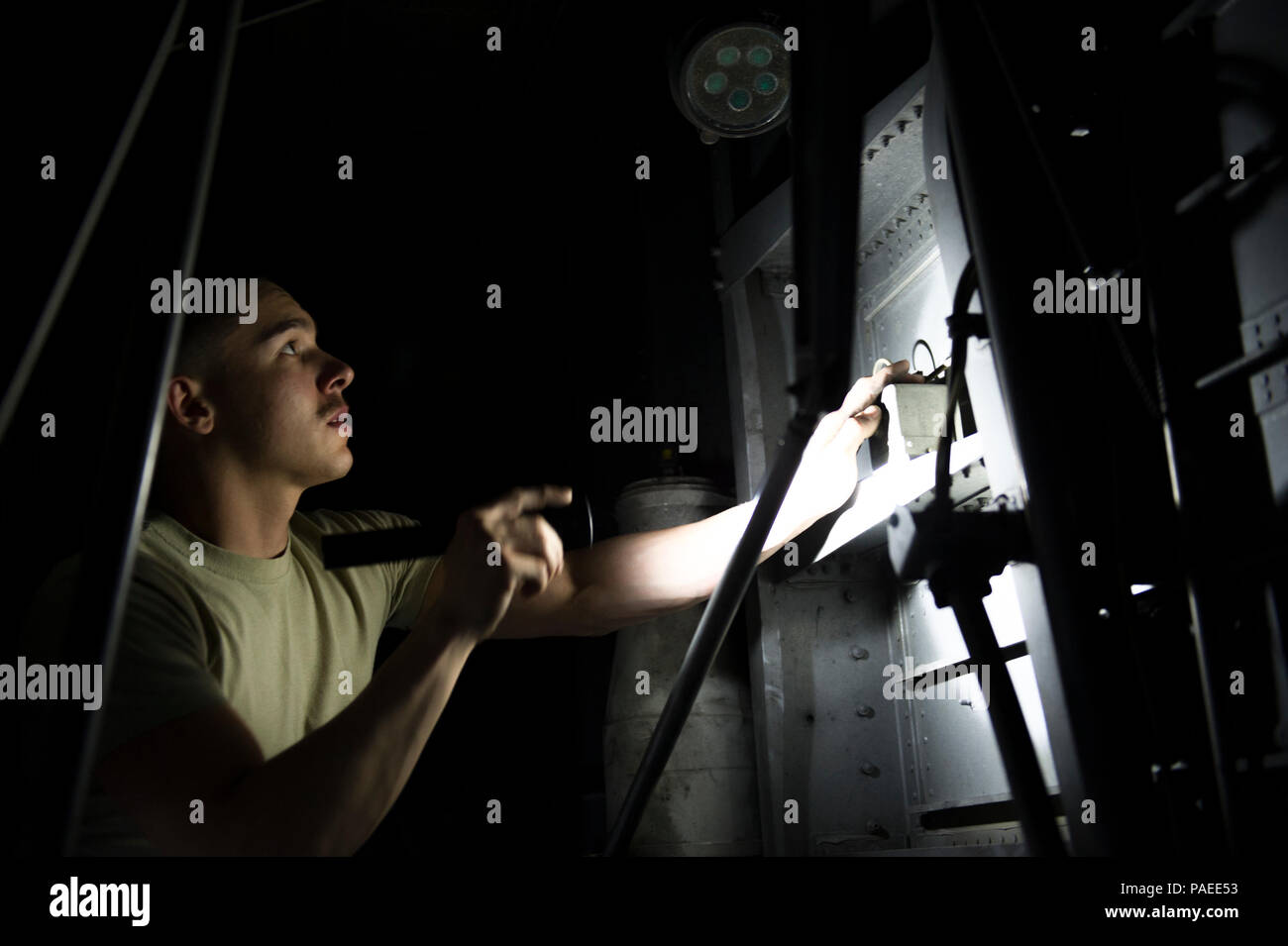 Senior Airman Alec Flores, 455th Expeditionary Aircraft Maintenance Squadron crew chief, visually inspects the wheel well of a C-130J Super Hercules during a basic post- and pre-flight combo inspection at Bagram Airfield, Afghanistan, March 29, 2016. Members of the 455th EAMXS ensure that aircraft at Bagram are prepared for flight and return them to a mission-ready state once they land. (U.S. Air Force photo/Tech. Sgt. Robert Cloys) Stock Photo
