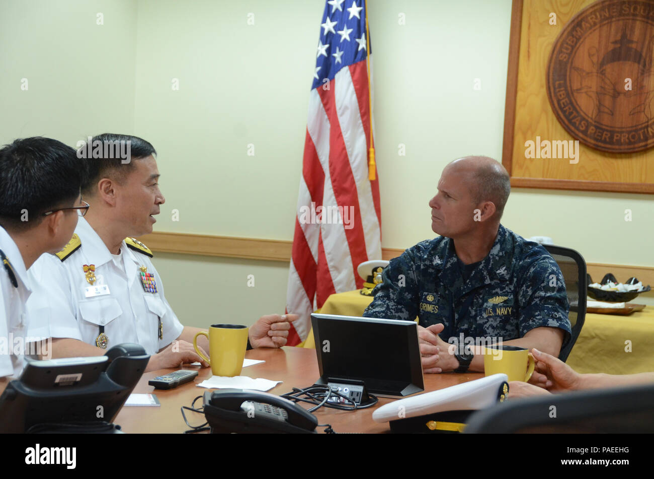 160328-N-YM720-006 SANTA RITA, Guam (March 31, 2016) Rear Adm. Youn Jeong Sang, commander, Submarine Force (CSF), Republic of Korea Navy (ROKN), meets with Capt. Jeffrey Grimes, commander, Submarine Squadron 15, during an office call prior to the 43rd Submarine Warfare Committee Meeting (SWCM). SWCM is a bilateral discussion between the U.S. and ROKN submarine forces designed to foster the partnership and focuses on submarine tactics, force integraton and future submarine development. (U.S. Navy photo by MC3 Allen McNair/Released) Stock Photo