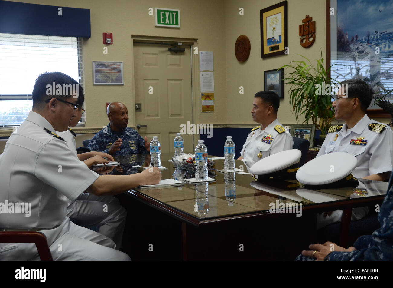 160331-N-YM720-031 SANTA RITA, Guam (March 31, 2016) Rear Adm. Youn Jeong Sang, commander, Submarine Force (CSF), Republic of Korea Navy (ROKN), right center, and other members of the ROKN submarine forces meet with Capt. Andy Anderson, commanding officer, Naval Base Guam, left center, before the first day of the 43rd Submarine Warfare Committee Meeting (SWCM). SWCM is a bilateral discussion between the U.S. and ROKN submarine forces designed to foster the partnership and focuses on submarine tactics, force integraton and future submarine development. (U.S. Navy photo by MC3 Allen McNair/Relea Stock Photo