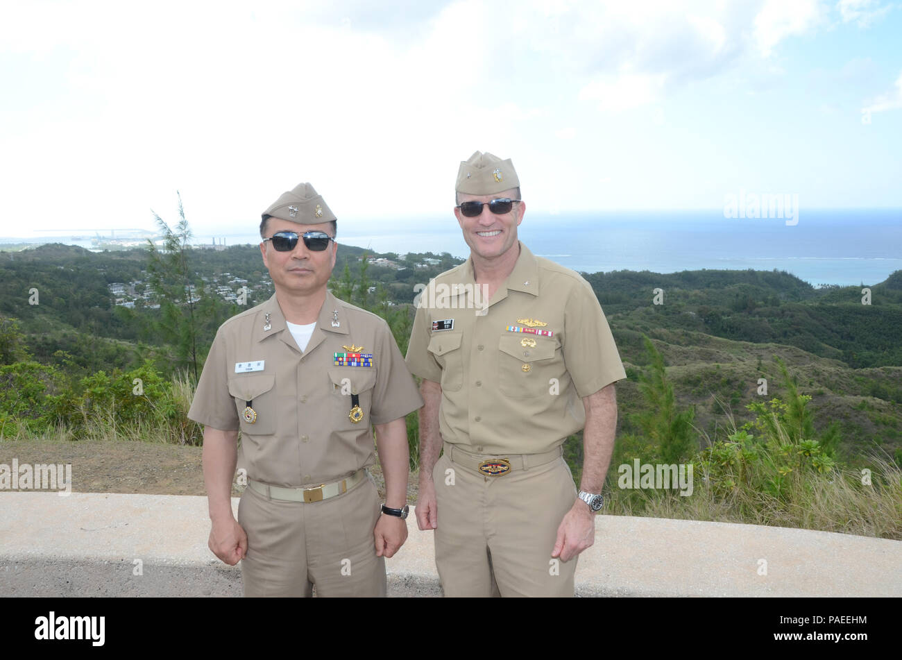 160331-N-YM720-234 SANTA RITA, Guam (March 31, 2016) Rear Adm. Youn Jeong Sang, commander, Submarine Force, Republic of Korea Navy (ROKN), left, and Rear Adm. William Merz, commander, Submarine Group 7 post at Asan Bay Overlook on Nimitz Hill after the first day of the 43rd Submarine Warfare Committee Meeting (SWCM). SWCM is a bilateral discussion between the U.S. and ROKN submarine forces designed to foster the partnership and focuses on submarine tactics, force integraton and future submarine development. (U.S. Navy photo by MC3 Allen McNair/Released) Stock Photo
