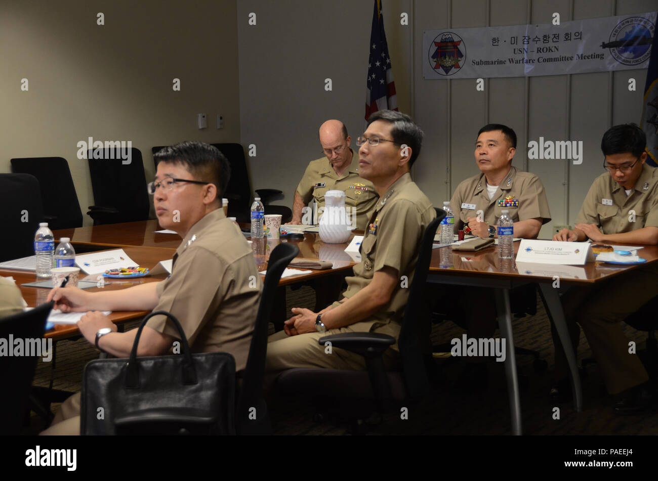 160331-N-YM720-253 SANTA RITA, Guam (March 31, 2016) Rear Adm. William Merz, commander, Submarine Group 7, left center, and Rear Adm. Youn Jeong Sang, commander, Submarine Force, Republic of Korea Navy (ROKN), right center, lead other members of the U.S. and ROKN submarine forces during the 43rd Submarine Warfare Committee Meeting (SWCM). SWCM is a bilateral discussion between the U.S. and ROKN submarine forces designed to foster the partnership and focuses on submarine tactics, force integraton and future submarine development. (U.S. Navy photo by MC3 Allen McNair/Released) Stock Photo