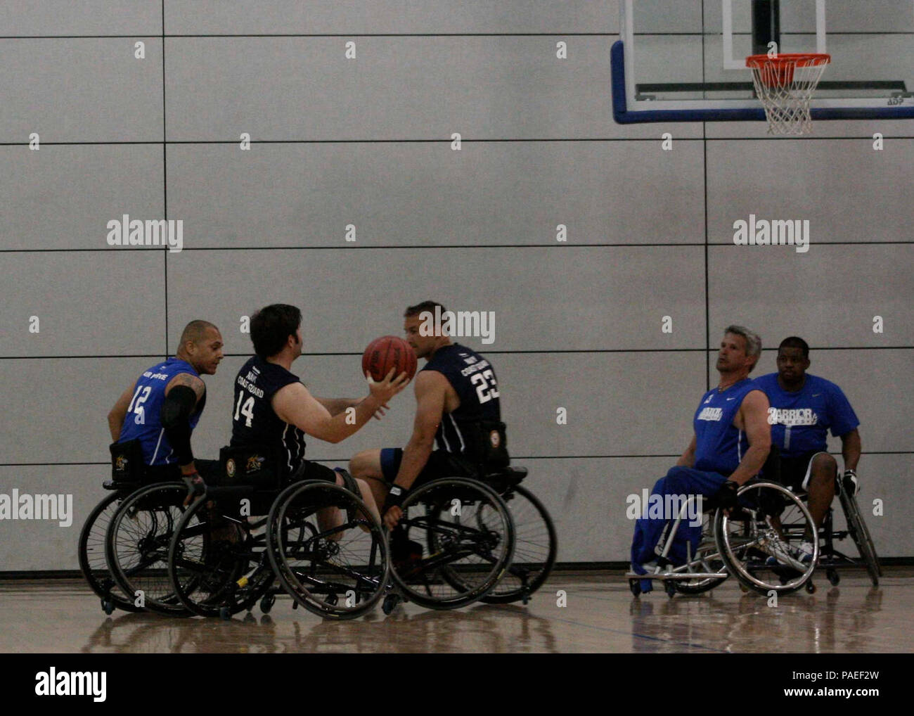 Team Navy/Coast Guard member, retired Explosive Ordnance Disposal 1st Class John Kremer of Buford, Ga., prepares to shoot the ball during a game of wheelchair basketball against Team Air Force, May 14 at the 2013 Warrior Games. The Warrior Games includes competitions in archery, cycling, seated volleyball, shooting, swimming, track and field, and wheelchair basketball. The goal of the Warrior Games is not necessarily to identify the most skilled athletes, but rather to demonstrate the incredible potential of wounded warriors through competitive sports. More than 200 wounded, ill, or injured se Stock Photo