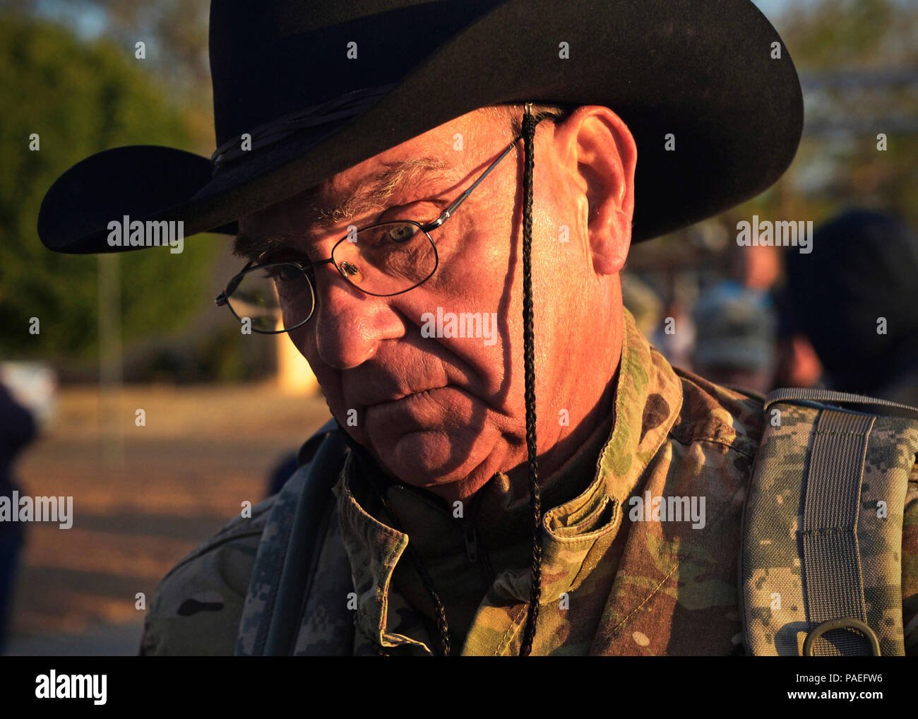 A participant in the Bataan Memorial Death March begins his march at White Sands Missile Range, New Mexico, March 20, 2016. The Bataan Memorial Death March honors a special group of World War II heroes. These service members were responsible for the defense of the islands of Luzon, Corregidor and the harbor defense forts of the Philippines. On April 9, 1942, tens of thousands of American and Filipino service members surrendered to Japanese Forces, and were then marched for days through the Philippine jungles. In honor of their sacrifice, more than 6,500 people participated in the 26.2 mile mar Stock Photo