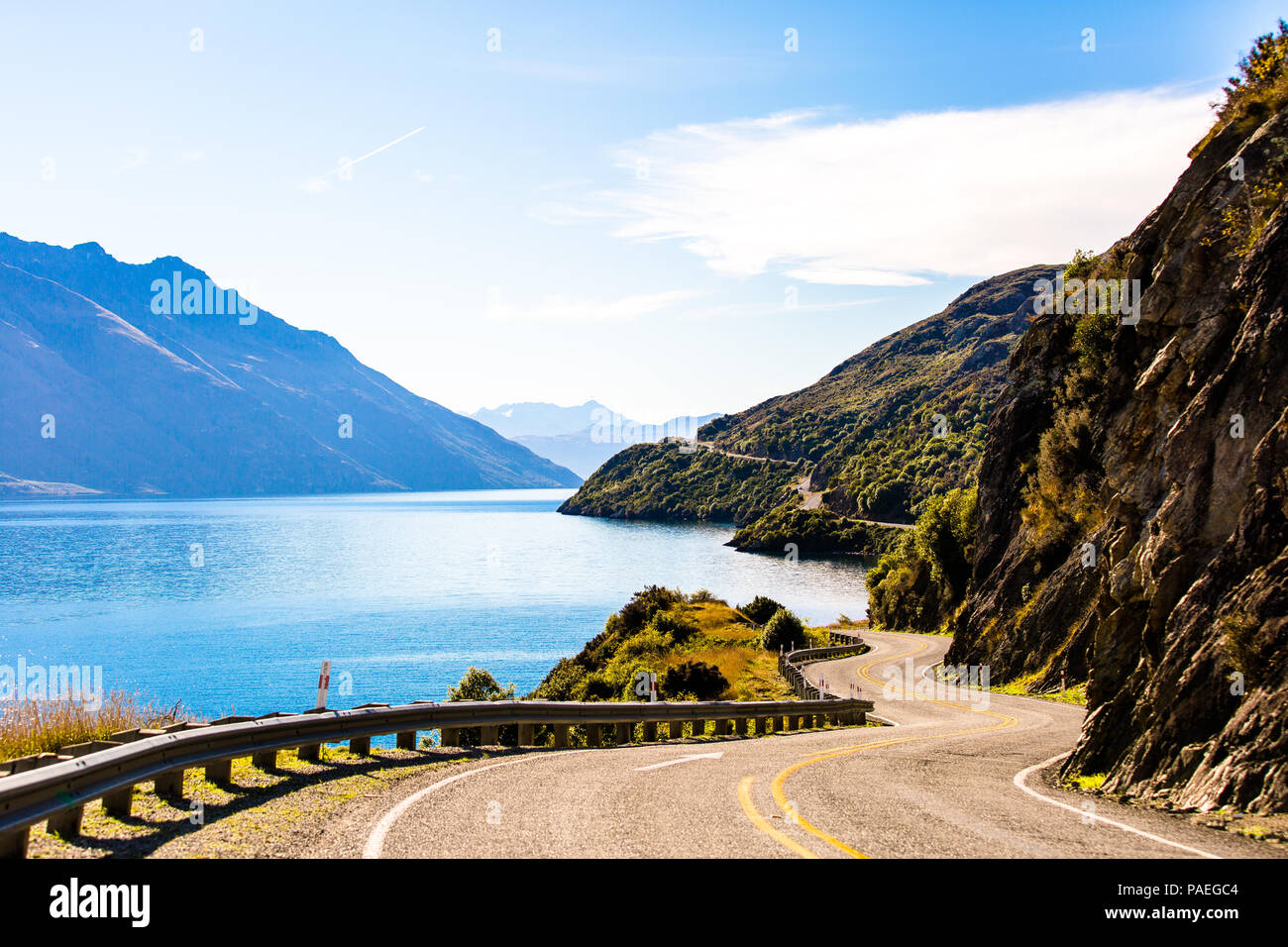Endless Travels On A Beautiful, Mountain-Winding Road In Queenstown, New Zealand Stock Photo
