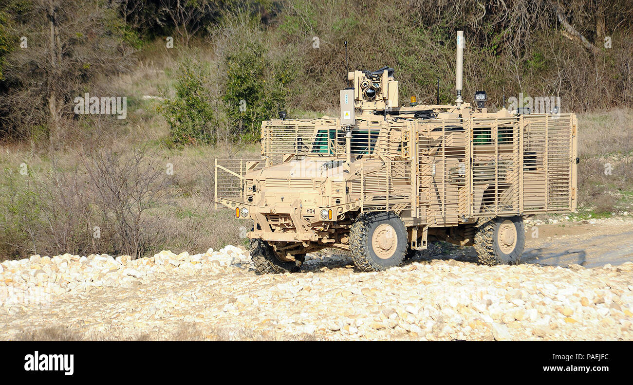 The Medium Mine Protected Vehicle, Type II (MMPV II), traverses a low ...