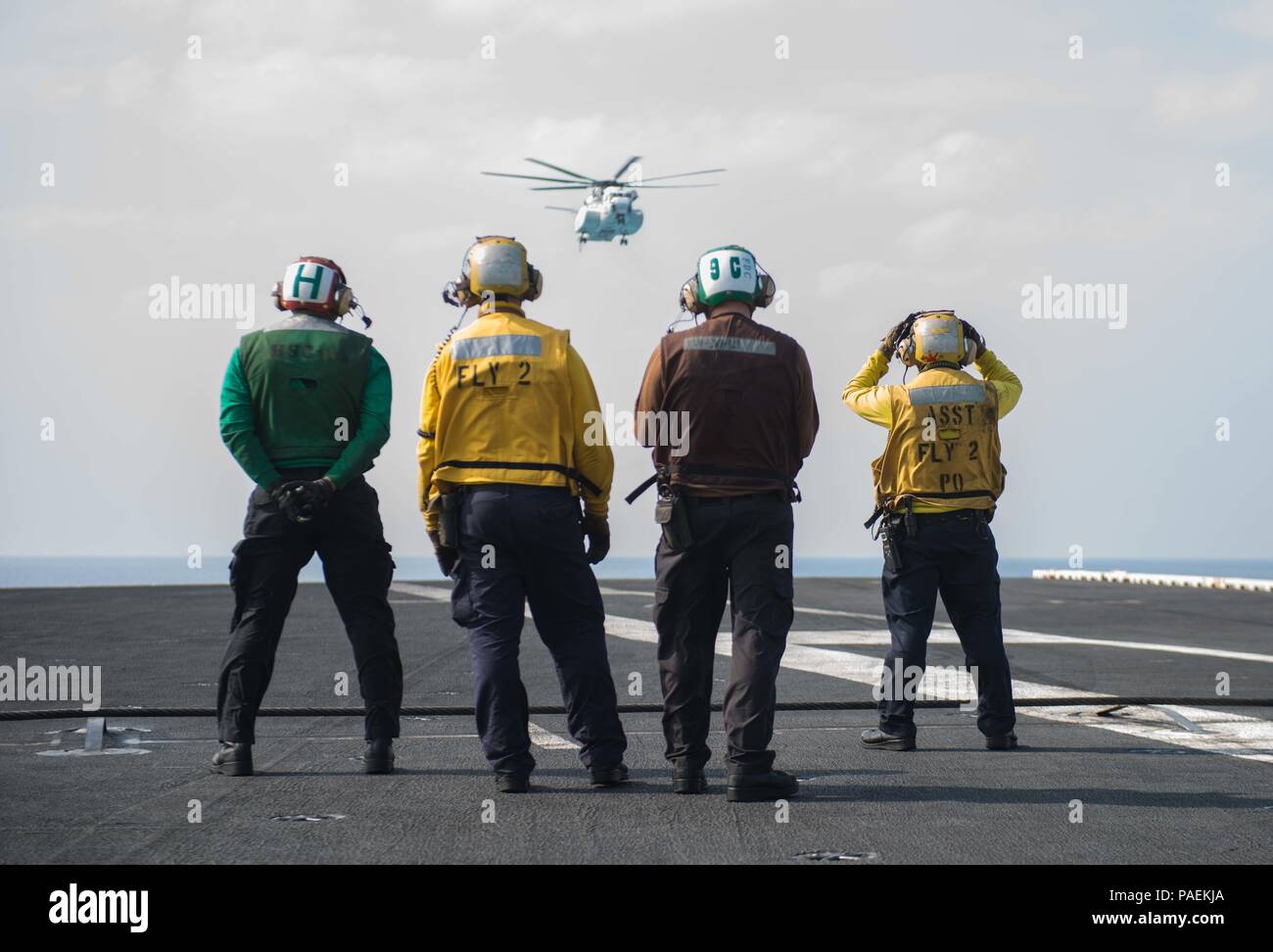 160329-N-BR087-052  PHILIPPINE SEA (March 29, 2016) A Japanese Maritime Self-Defense Force (JMSDF) H-53 helicopter approaches USS John C. Stennis' (CVN 74) flight deck to transfer JMSDF naval liaison officers. Providing a ready force supporting security and stability in the Indo-Asia-Pacific, John C. Stennis is operating as part of the Great Green Fleet on a regularly scheduled 7th Fleet deployment. (U.S. Navy photo by Mass Communication Specialist Seaman Cole C. Pielop/Released) Stock Photo