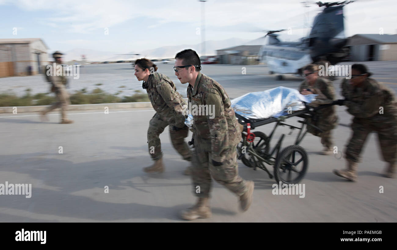 A medical response team transports a patient from a helicopter to the Craig Joint Theater Hospital during a mass casualty exercise Oct. 30, 2016 at Bagram Airfield, Afghanistan. There were more than a dozen patients and an all-hands-on-deck response from the 455th Expeditionary Medical Group and their Army partners at the 710th Area Support Medical Company. (U.S. Air Force photo by Staff Sgt. Katherine Spessa) Stock Photo
