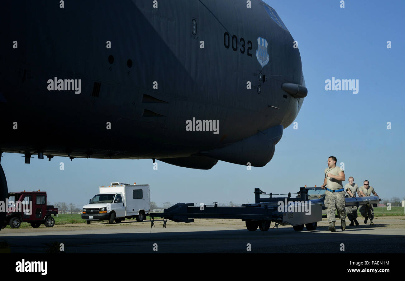 Crew chiefs from the 20th Aircraft Maintenance Unit prepare to tow a B ...
