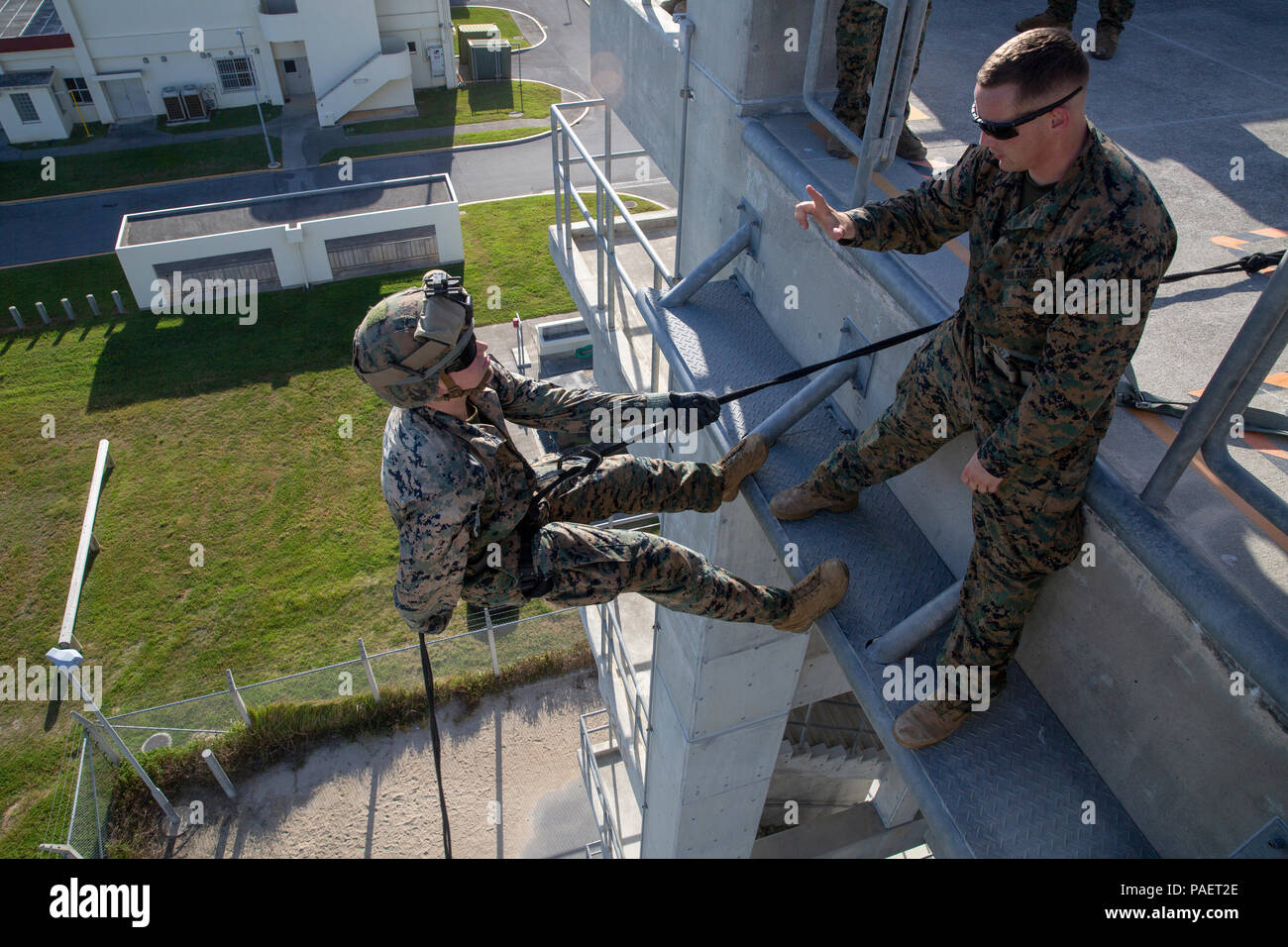 Sgt. Damen Estes supervises a Marine conducting skid rappel training