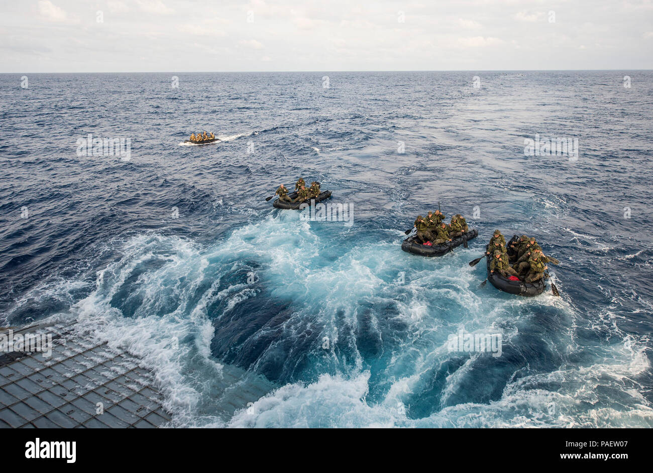 Marines assigned to Company F, Battalion Landing Team, 2nd Battalion, 5th Marines, 31st Marine Expeditionary Unit (31st MEU), conduct launch and recovery operations with combat rubber raiding craft from the well deck of the amphibious transport dock ship USS Denver (LPD 9). Denver is assigned to the Bonhomme Richard Amphibious Ready Group and is conducting operations in the U.S. 7th Fleet area of responsibility. Stock Photo