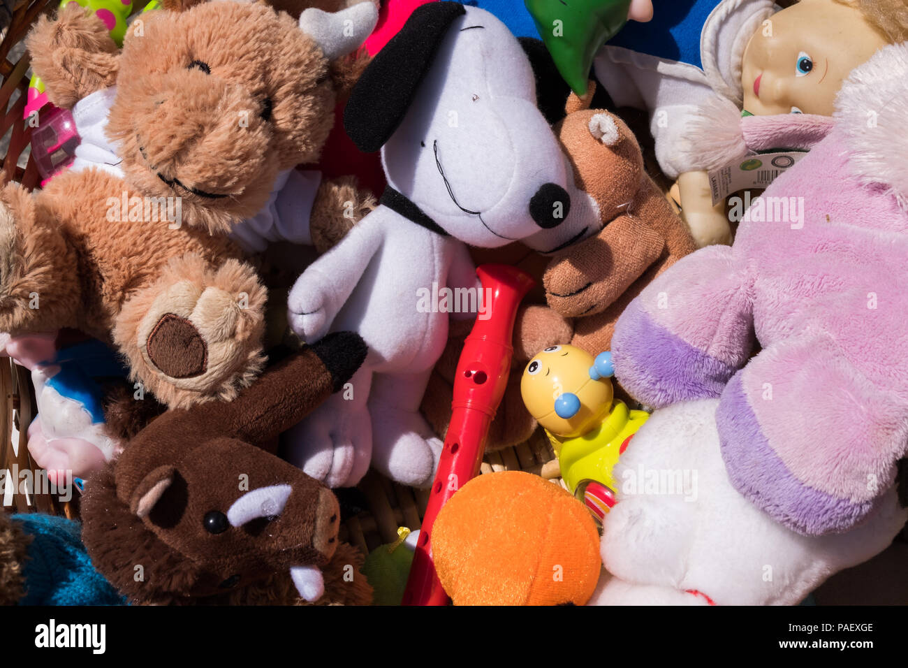 Colorful toy puppets on a basket. Stock Photo
