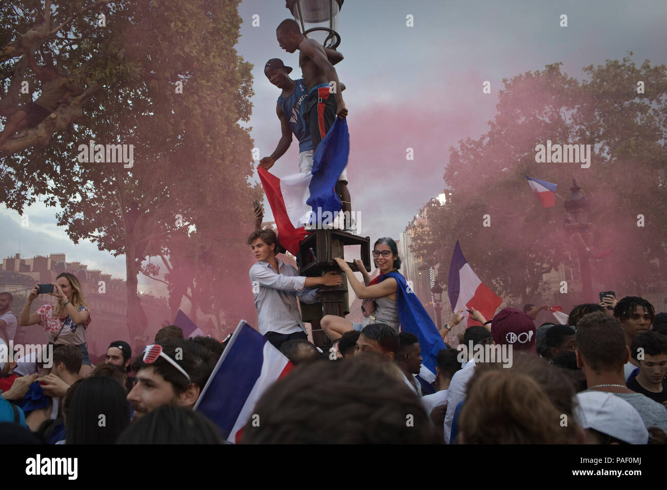 French fans celebrate on the Champs-Elysees avenue after France won the World Cup against Croatia, Paris, France, July 15, 2018. Stock Photo