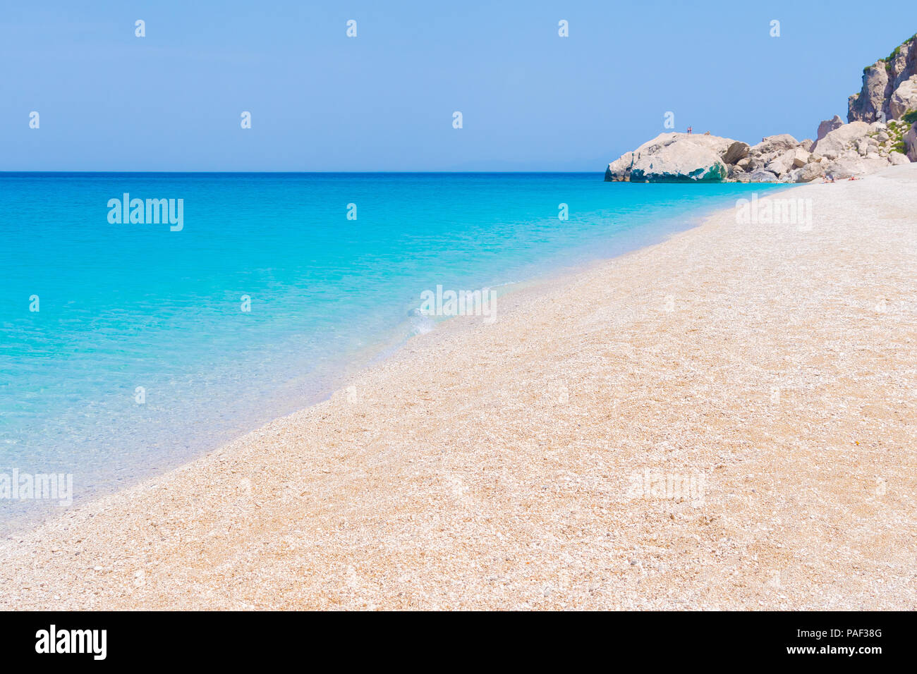 Crystal clear turquoise sea waters of a pebble beach. Kathisma beach in Lefkada ionian island in Greece Stock Photo