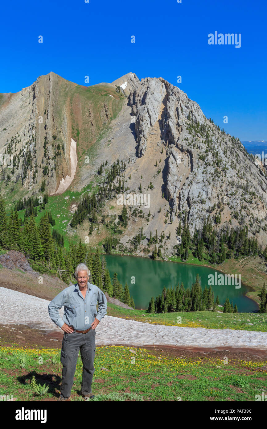 self portrait of john lambing above frazier lake in the bridger