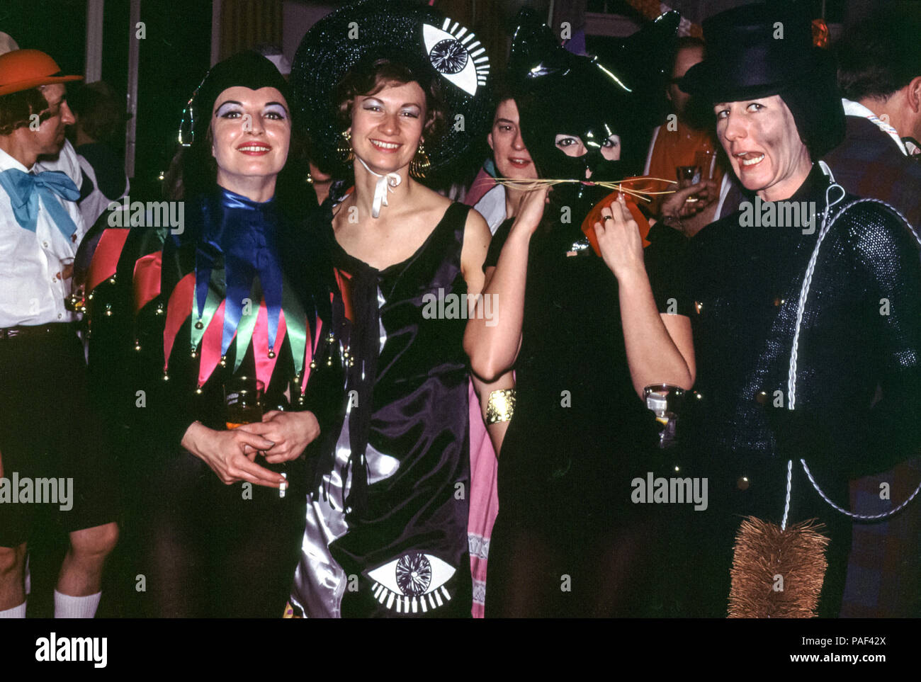 Expats at a fancy dress party, Hamburg, Germany in the 1960s. Women in  fancy dress costumes including a cat, a jester and a chimney sweep Stock  Photo - Alamy