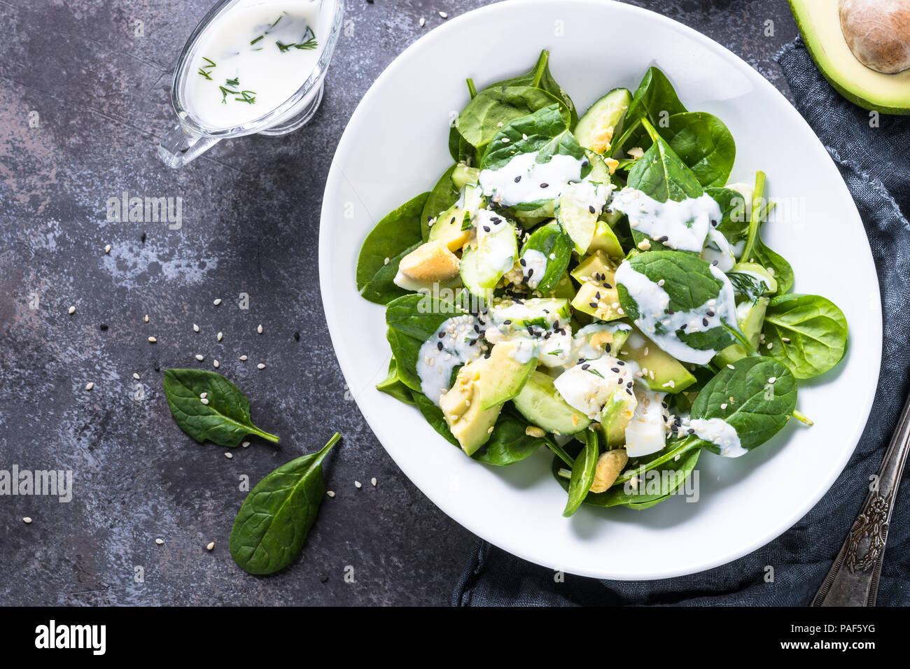 Green salad with avocado, spinach egg and cucumber Stock Photo - Alamy